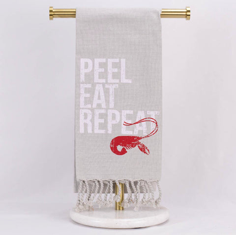 light gray hand towel featuring crawfish with the words peel, eat, repeat
